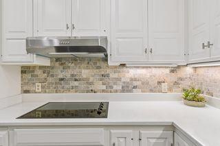 Stone backsplash brings warmth to the kitchen!