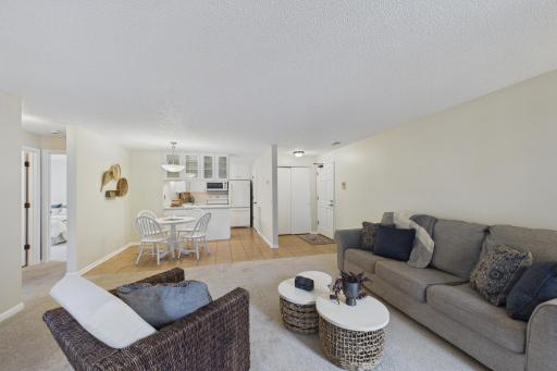 The living room is open to the dining room and kitchen.