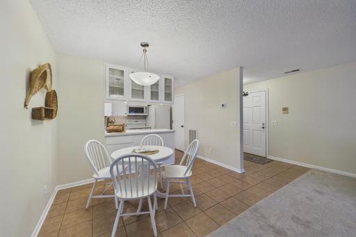 Tile flooring in the entry, dining, and kitchen.