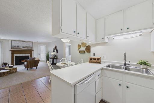 Drop-down cabinets create a pass-through with an open-but-dedicated kitchen area.