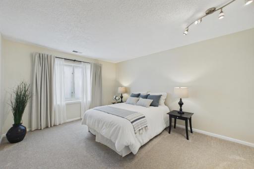 The primary bedroom has large south-facing windows.