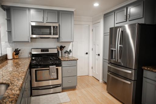 Stainless appliances and good cabinet storage in the kitchen.