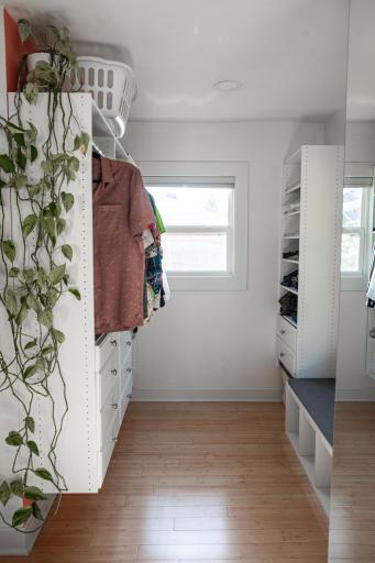 Primary closet offers plenty of organized storage.