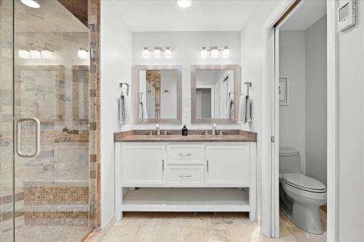 Primaary bathroom with dual sinks and heated floors.jpg
