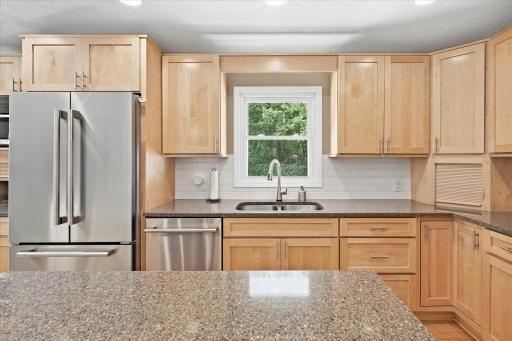 Abundant cabinets for storage and stone countertops.jpg