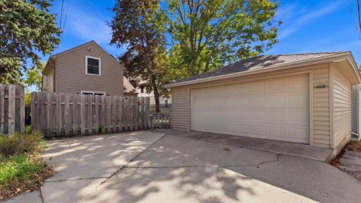 Fenced in backyard with large 2 car garage