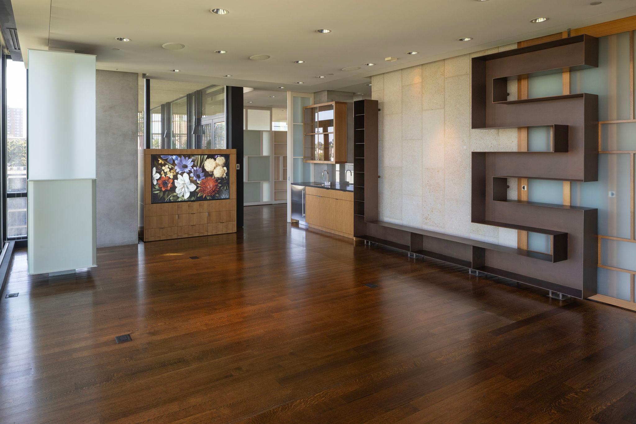 Family room off foyer with built-in TV center, bar and 2nd gas fireplace