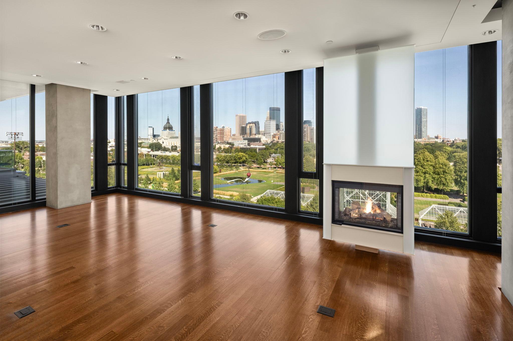 Family room with gas fireplace and glorious Sculpture Garden and skyline views