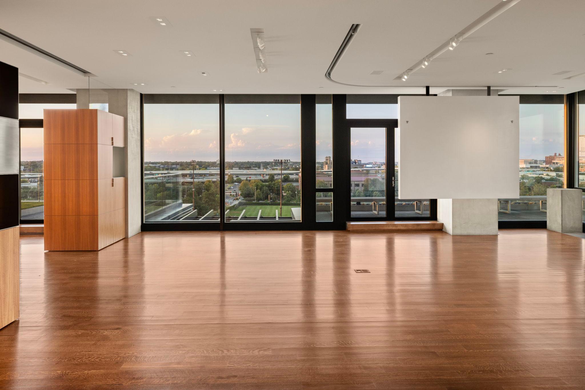 Great Room with terrace access and Parade Stadium views
