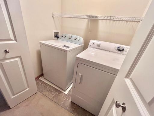Washer dryer in laundry area upstairs by the bedrooms