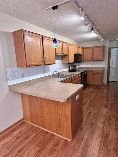 Kitchen with snack bar. Room for two barstools.