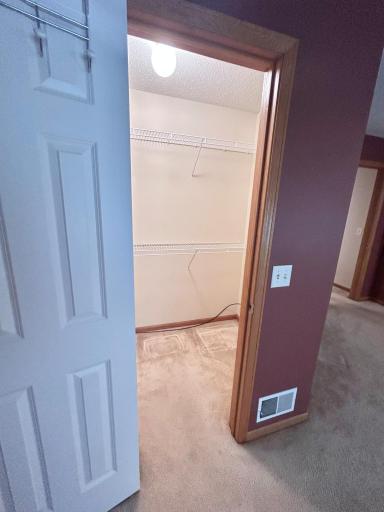 Walk in closet in primary bedroom