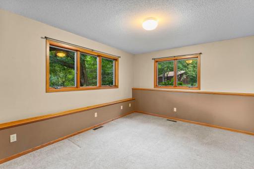 The third bedroom also brings plenty of light with tranquil window views