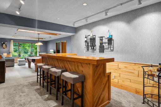The wet bar leading to the family room, is an excellent spot for gathering and entertaining guests