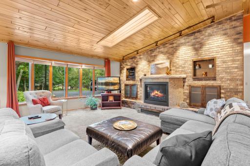 The awesome brick feature wall offers a media space and multiple built-ins for added storage