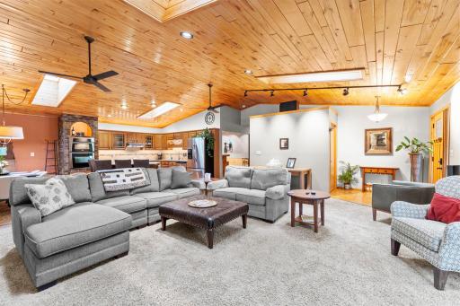 Open concept living room that opens to the kitchen and dining area