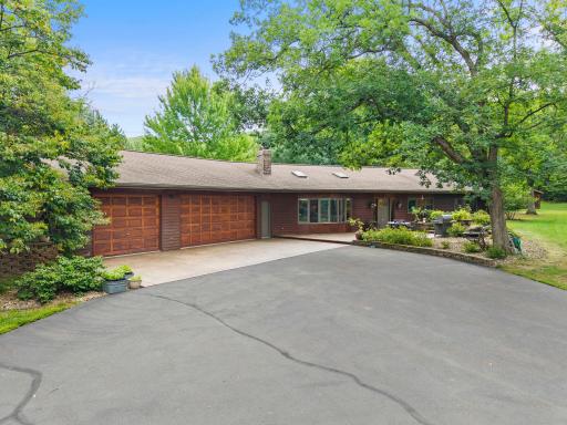 Low maintenance asphalt driveway and a beautiful stamped concrete patio