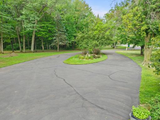 As you enter and leave you'll appreciate the easy access circle driveway and canopy of trees that create the private oasis this amazing property has to offer