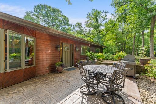 Tucked back off the road, surrounded by mature trees, gardens & perennials