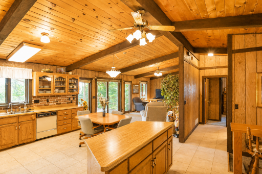 Open kitchen and living room with access to covered deck.png