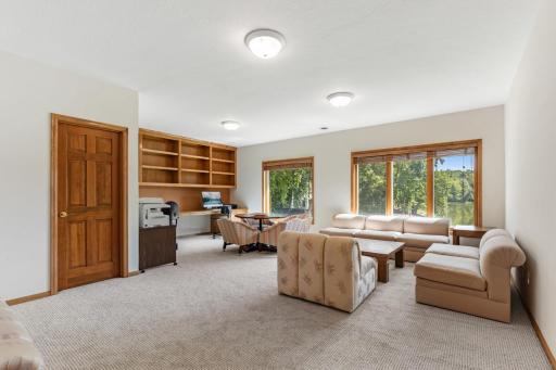 Spacious fifth bedroom on the walkout lower level featuring brand-new carpet, a walk-in closet, and its own private 3/4 bathâan ideal guest suite or private retreat.