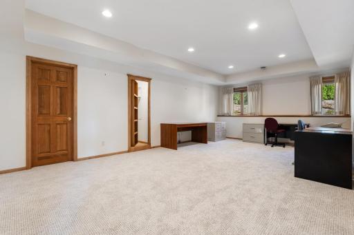 Sixth bedroom located on the walkout lower level, offering a comfortable and private space for family, guests, or a home office.