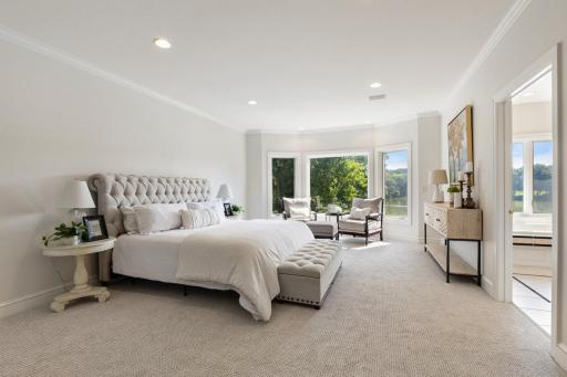 Spacious main-level primary suite offering a peaceful retreat with brand-new carpet and convenient access to the private primary bath and walk-in closet.