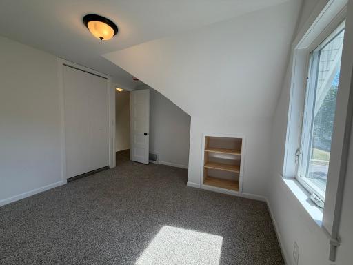 2955 Queen 2nd Bedroom Closet and built in bookshelf.jpeg