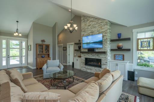LIVING ROOM FLOOR TO CEILING STONE GAS FIREPLACE