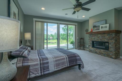 PRIMARY BEDROOM WITH GAS FIREPLACE