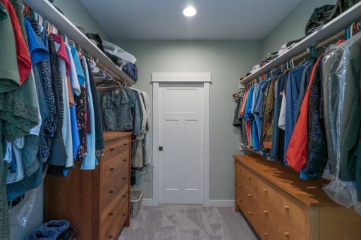 WALK-IN CLOSET IN PRIMARY BEDROOM