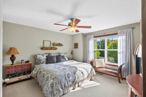 Spacious & Bright Primary Bedroom Suite complete with private bathroom, large walk-in closet, ceiling fan & Hunter Douglas Blinds!