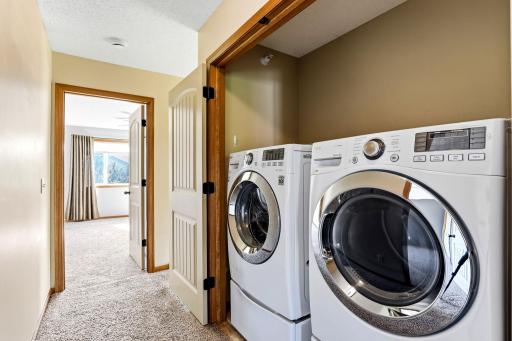Convenient upper-level laundry closet located near the bedrooms, making everyday laundry tasks easy and accessible.