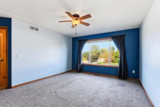 Enjoy the most beautiful views from this spacious primary bedroom featuring abundant natural light, a large walk-in closet, and a private en-suite bathroom.