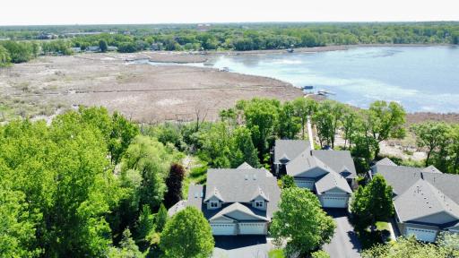 Welcome home to maintenance-free lakeside living. This beautifully maintained townhome offers elegant curb appeal, a 2-car garage, and a desirable cul-de-sac location surrounded by mature trees on Eagle Lake!