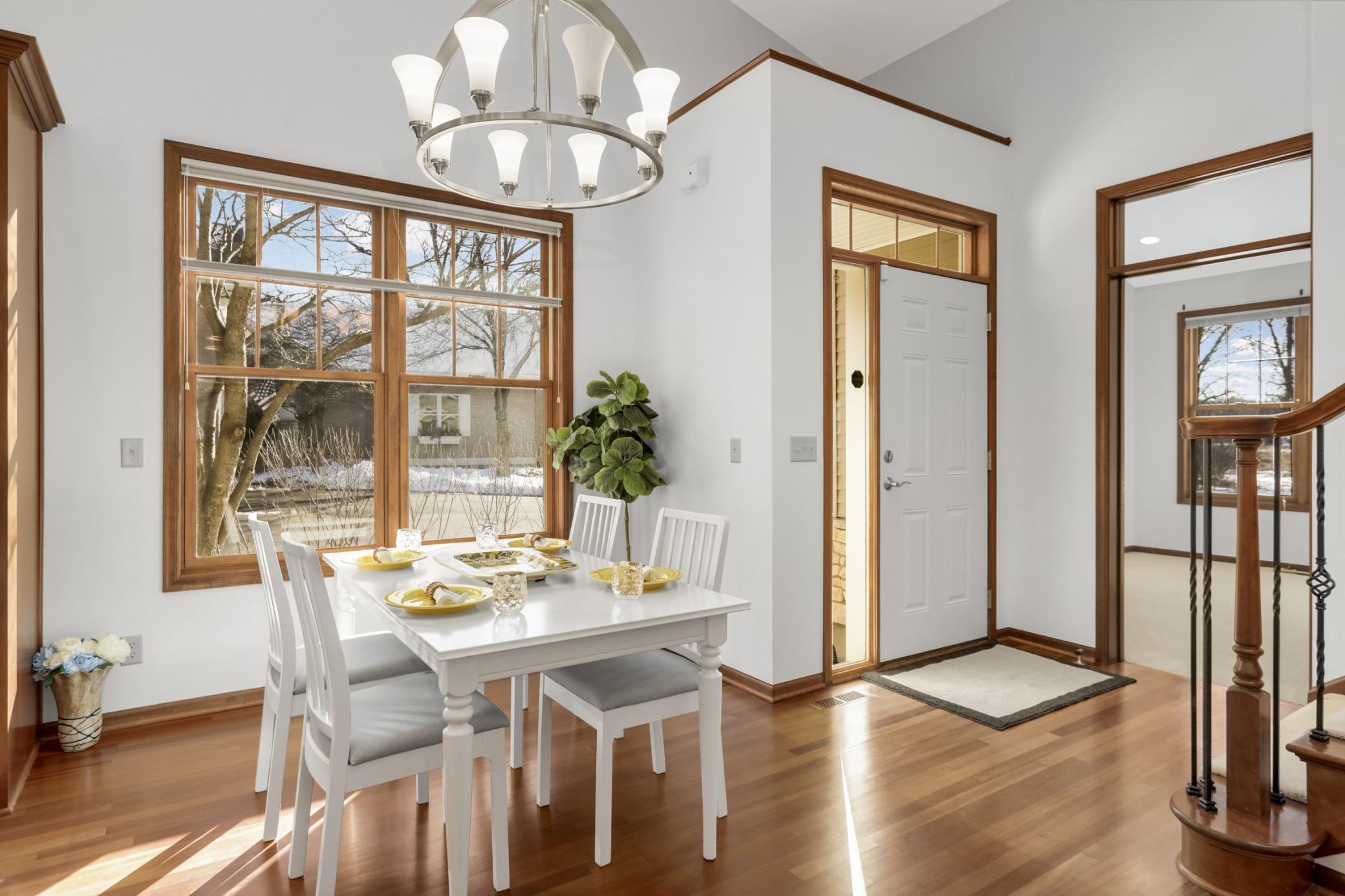 Inviting main-level dining area featuring abundant natural light and seamless connection to the living spaces