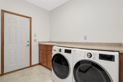 Main Level Laundry with plenty of counter space.