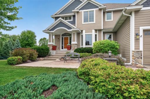 Front paver patio, hardie siding & brick/stone accents!