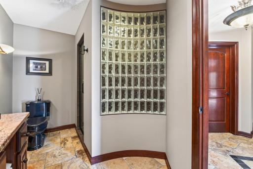 Curved glass wall in 3/4 bathroom