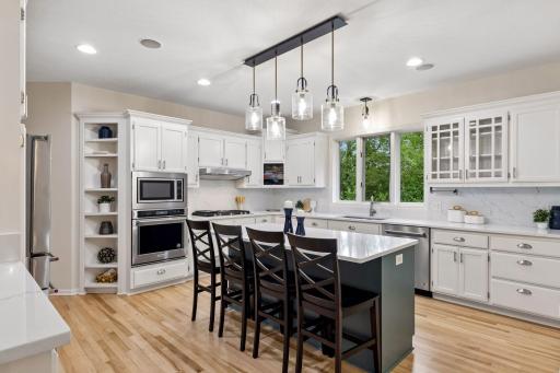 Kitchen with center island and ample cabinetry