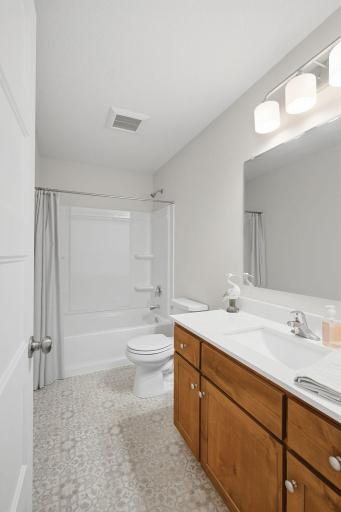 A full bathroom on the main level adds everyday convenience and works especially well with the nearby oversized bedroom.