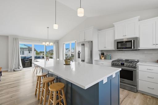 Function was considered in every detail, including cabinet pull-out shelves, quiet-close drawers, and a convenient sink tip-out tray. This kitchen offers much more than just beautiful finishes.