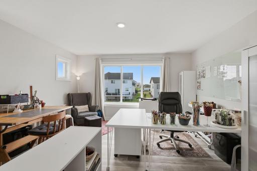The extra-large main-level bedroom features an oversized window that fills the room with natural light. Its size and convenient location make it an incredibly versatile space.