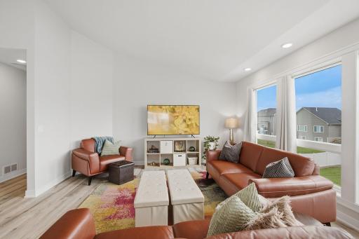 Enjoy an open-concept design with beautiful sightlines throughout the main level. This flexible living space offers plenty of room to gather while remaining connected to the kitchen and dining area.