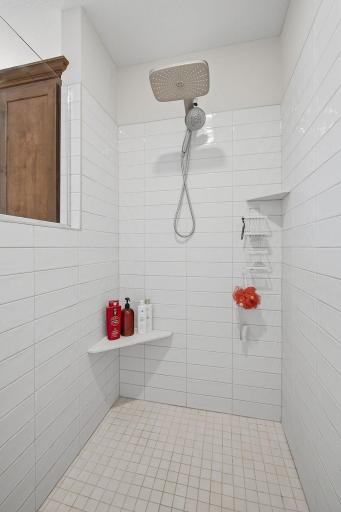 A large walk-in shower adds a luxurious touch to the primary suite. The separate shower and soaking tub give you the best of both options.