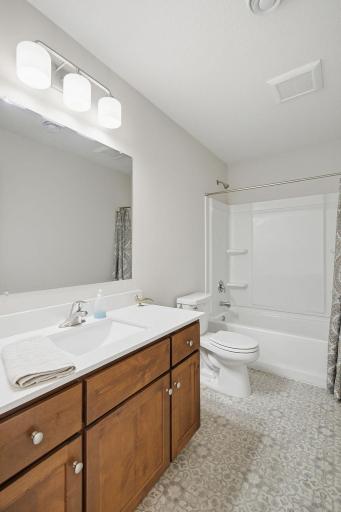 A full lower-level bathroom conveniently serves both bedrooms and the recreation area, giving the lower level excellent functionality.