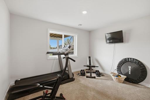 The second lower-level bedroom provides another comfortable and flexible living space. A full bathroom is conveniently located on this level as well.
