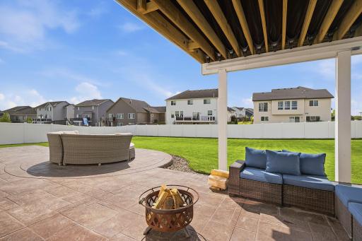 The walkout leads to an expansive custom stamped-concrete patio, providing another fantastic outdoor living area. The stamped concrete coordinates with the patio at the front of the home.