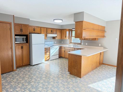 Bright, open kitchen with tons of cabinets and counterspace!