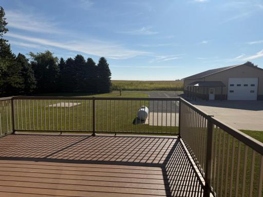 Maintenance free deck overlooking backyard and shop.